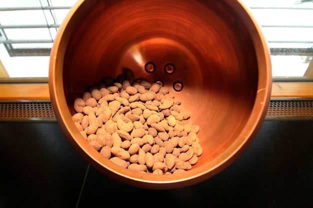 A close-up shot focusing on the internal mechanism of the DIY pet feeder, highlighting the electronic components (Arduino, servo motor) and the food dispensing system. The wiring and connections should be visible, demonstrating the core technology.