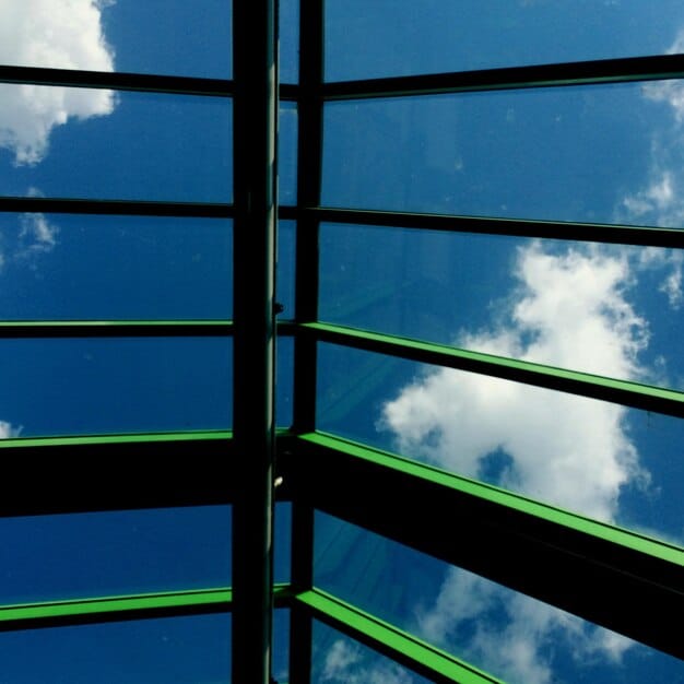 A close-up shot of a window's cross-section, clearly showing the multiple panes of glass, gas fills, and low-E coatings that contribute to its energy efficiency.