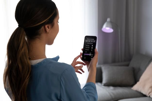 A person using a smartphone app to view energy consumption data from a smart home energy monitor. The app displays graphs and charts showing energy usage patterns, and the person is pointing at a suspicious spike in consumption.