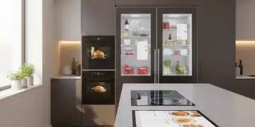 Futuristic smart kitchen with integrated appliances and digital recipe display