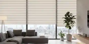 Modern living room with smart blinds, tablet controlling automation